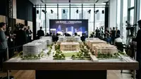 Vue aérienne futuriste du Campus Santé Grand Paris Nord, avec des bâtiments modernes et des espaces verts, symbolisant l'innovation et la recherche.