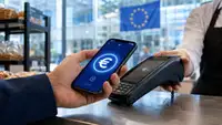 Paiement en euro numérique depuis un smartphone sur un terminal sans contact, avec le drapeau européen en arrière-plan.