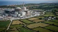 Ouvriers du BTP sur un chantier de construction, symbolisant la concurrence pour la main-d'œuvre qualifiée dans la Manche.
